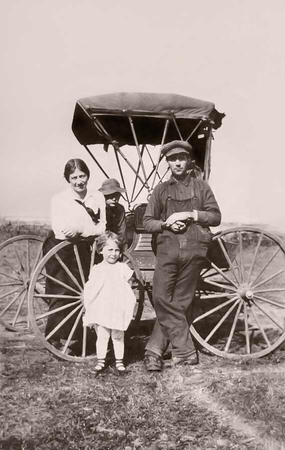 Photograph of Emily Campbell Davis, C. E. Davis, and children Peter and Emma.