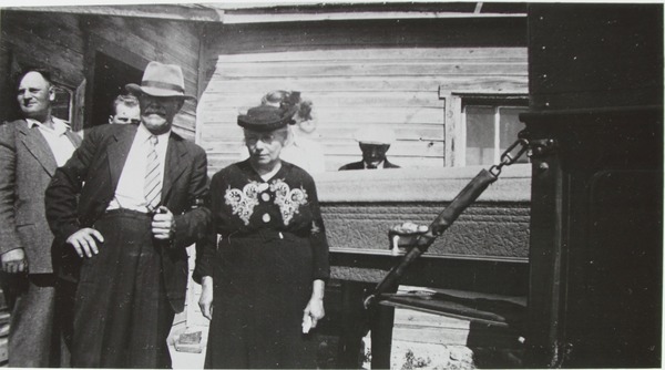 Bálint and Borbála Daku standing beside Lorinz Debreceni’s coffin, about 1939, with Frank Fónagy to their left.