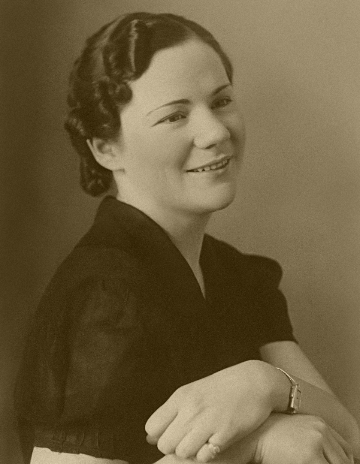 Sepia portrait of Grace Davis as a young woman.