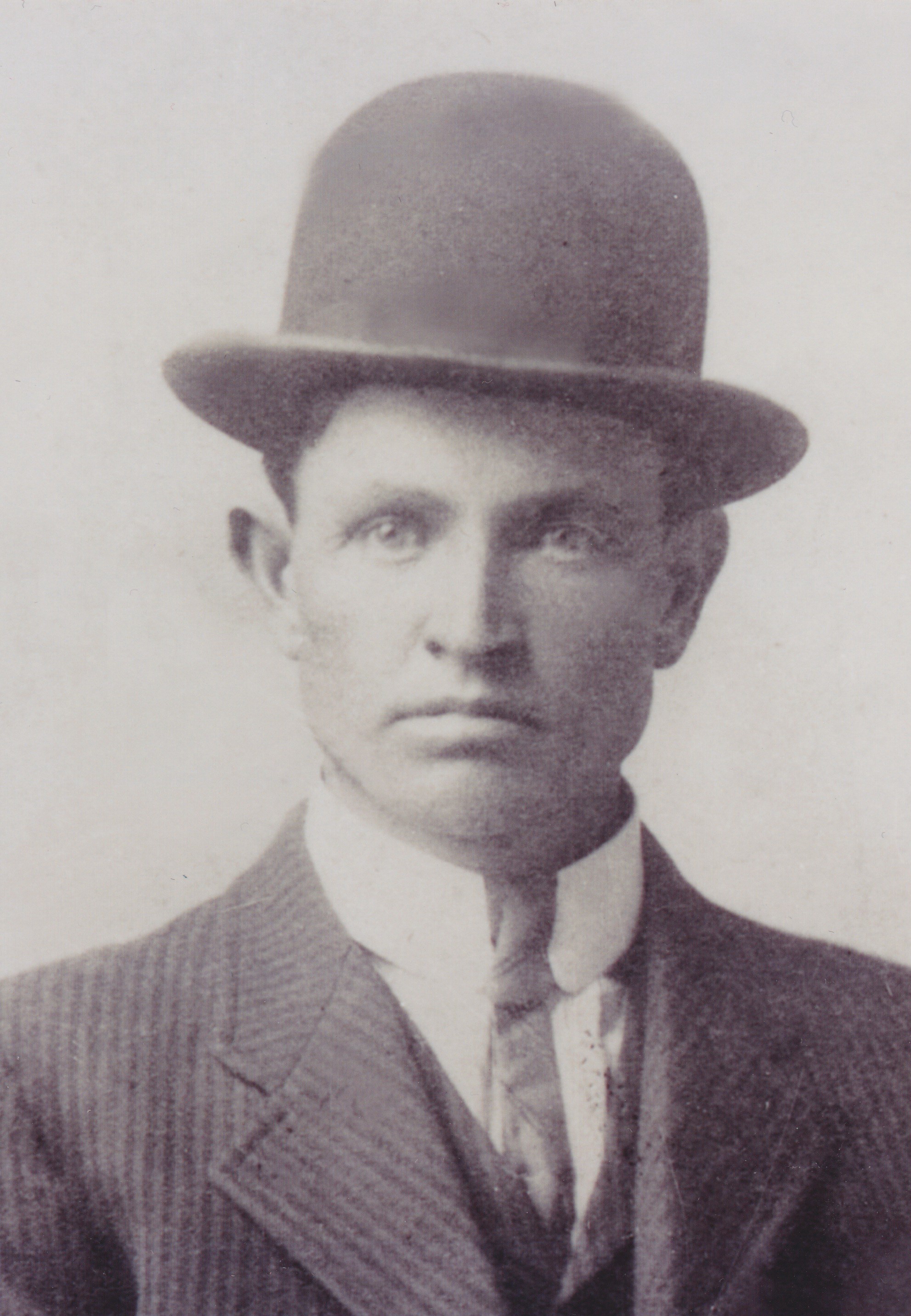 Portrait of Leonard Isaiah Nicholson wearing a bowler hat and suit.