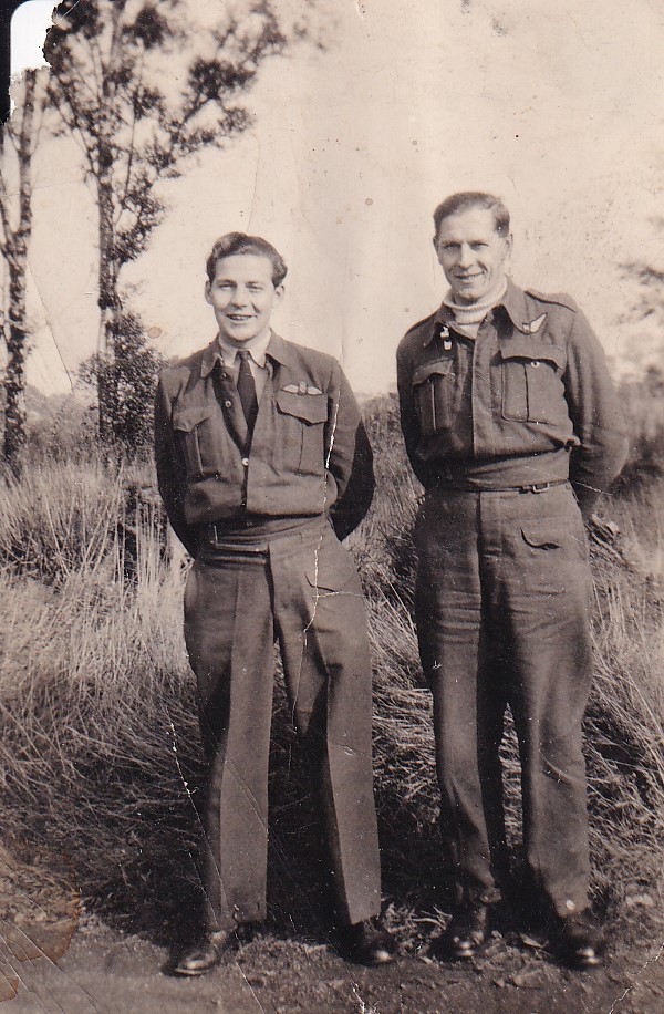 Two Royal Canadian Air Force airmen standing outdoors in uniform.