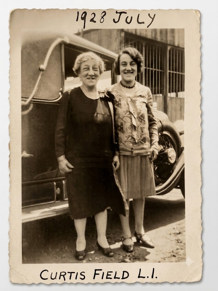 Sadie Tabor and Mildred Elizabeth Tabor standing beside a car at Curtis Field, Long Island, in July 1928